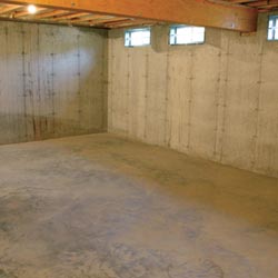 A cleaned out basement in Somerville, shown before remodeling has begun