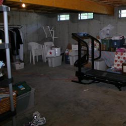 An unfinished basement filled with clutter in Lynn.