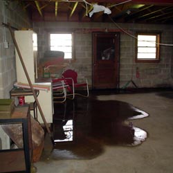 A flooded basement showing groundwater intrusion in Lowell
