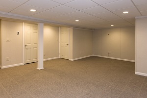 Finished Basement Space Finished basement space with waterproof wall paneling, ceiling tiles and floor system